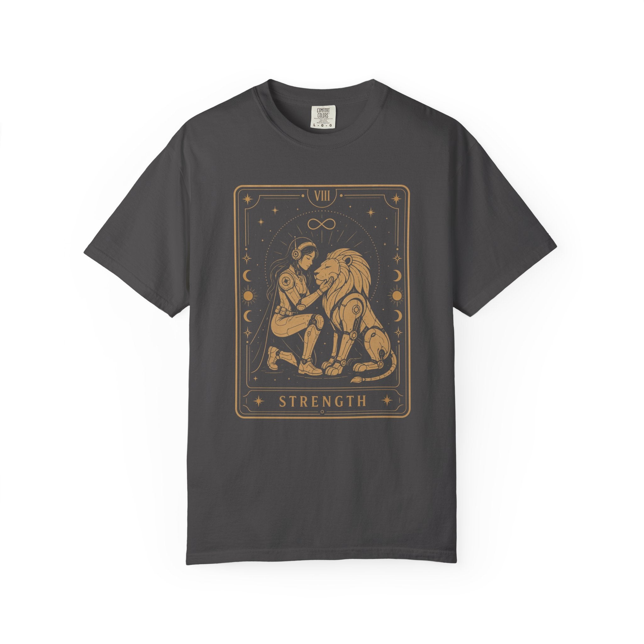 A gray crewneck t-shirt featuring a tarot card graphic of 'Strength' in gold. The graphic depicts a figure pulling a large lion, framed by stars and moon phases, with the Roman numeral VIII and the word 'STRENGTH' at the bottom.