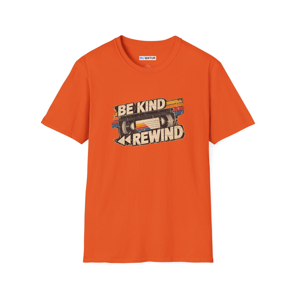 An orange short-sleeve crewneck t-shirt featuring a retro graphic on the chest with a VHS tape and the words 'BE KIND REWIND' in distressed beige and blue lettering, shown against a plain white background.