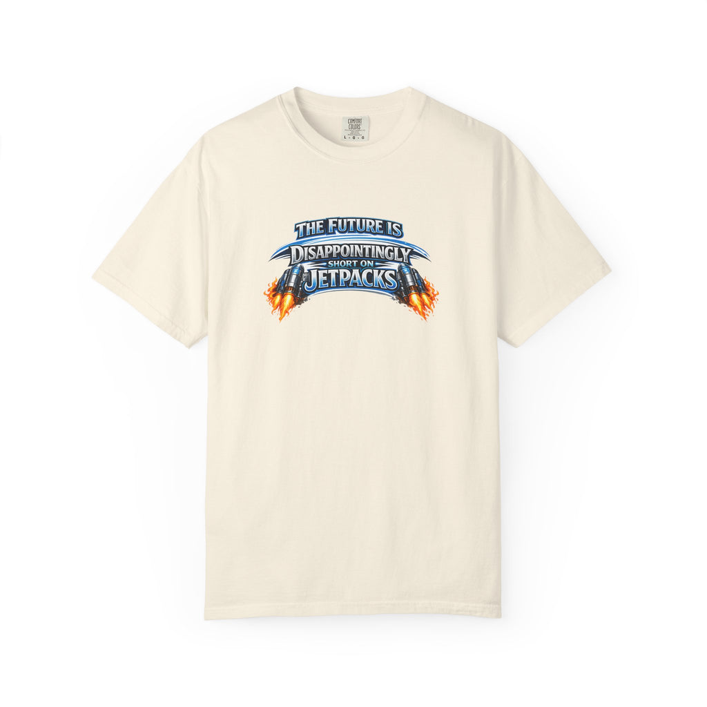 A beige short-sleeve crewneck t-shirt featuring a graphic print on the chest that reads 'THE FUTURE IS DISAPPOINTINGLY SHORT ON JETPACKS' in stylized blue and orange lettering with flame effects.