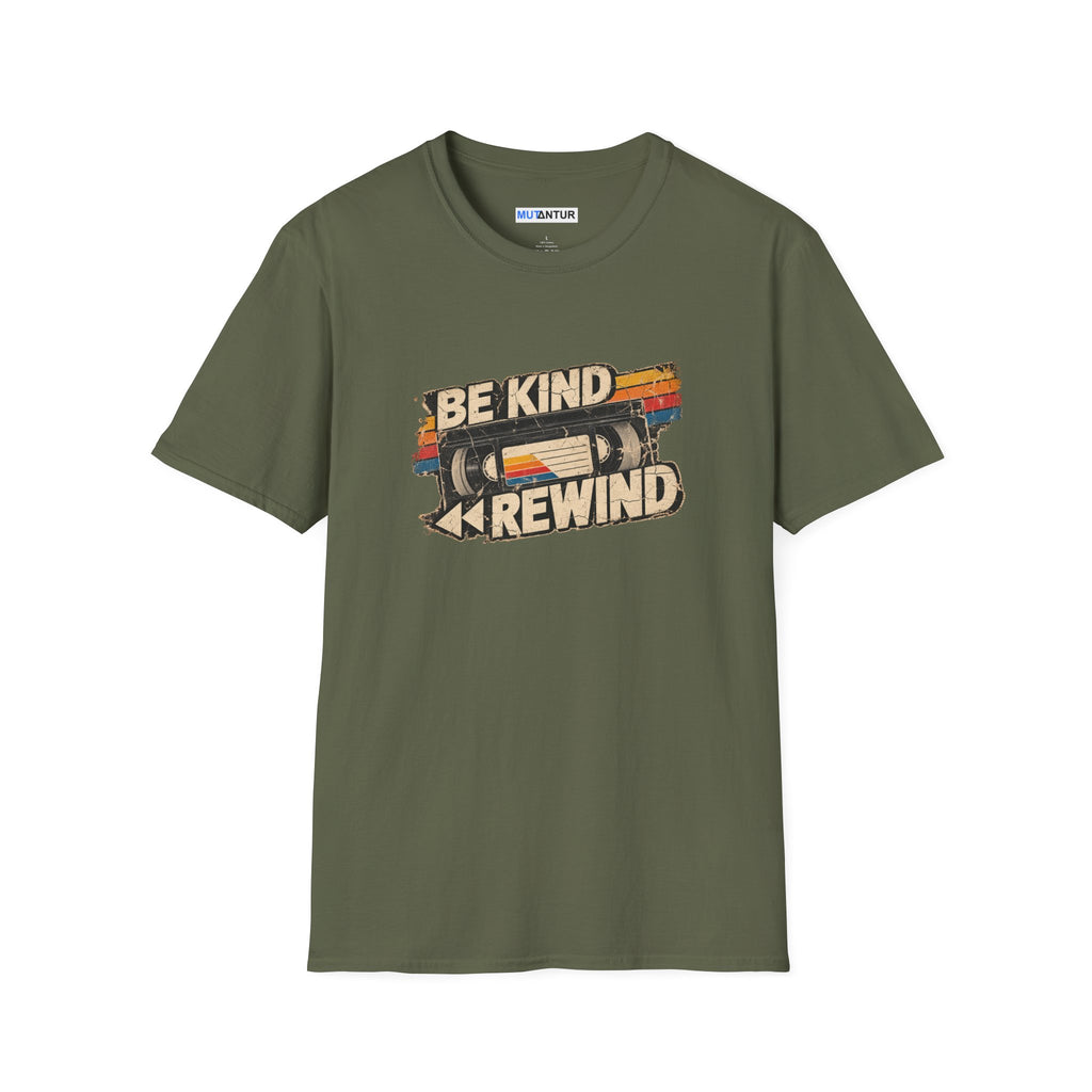 A military green short-sleeve t-shirt with a retro-style graphic on the chest featuring a VHS tape and the text 'BE KIND REWIND'. The shirt is displayed flat against a solid white background.
