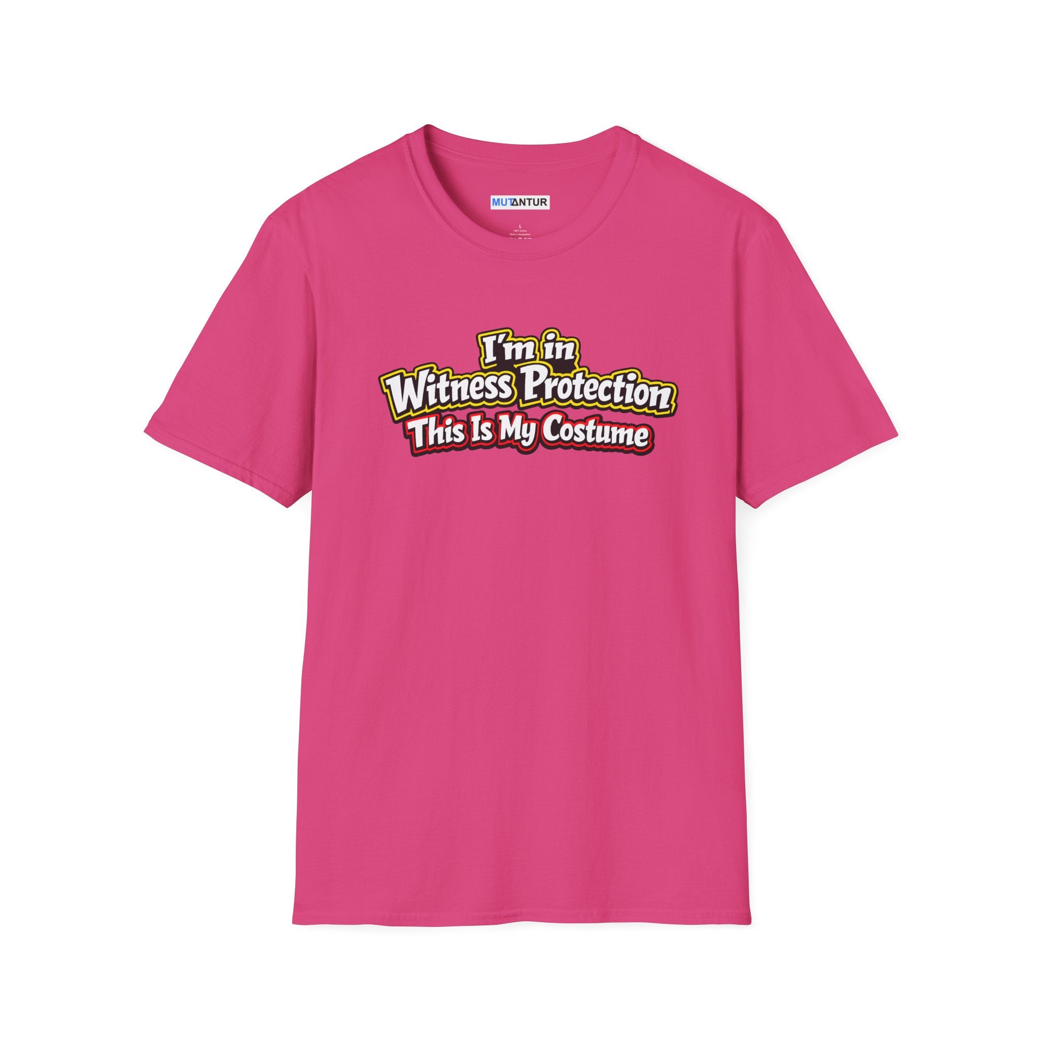 Pink short-sleeve crewneck t-shirt featuring a graphic on the chest that reads 'I'm in Witness Protection This Is My Costume' in a stylized, vintage font with green, yellow, and red accents