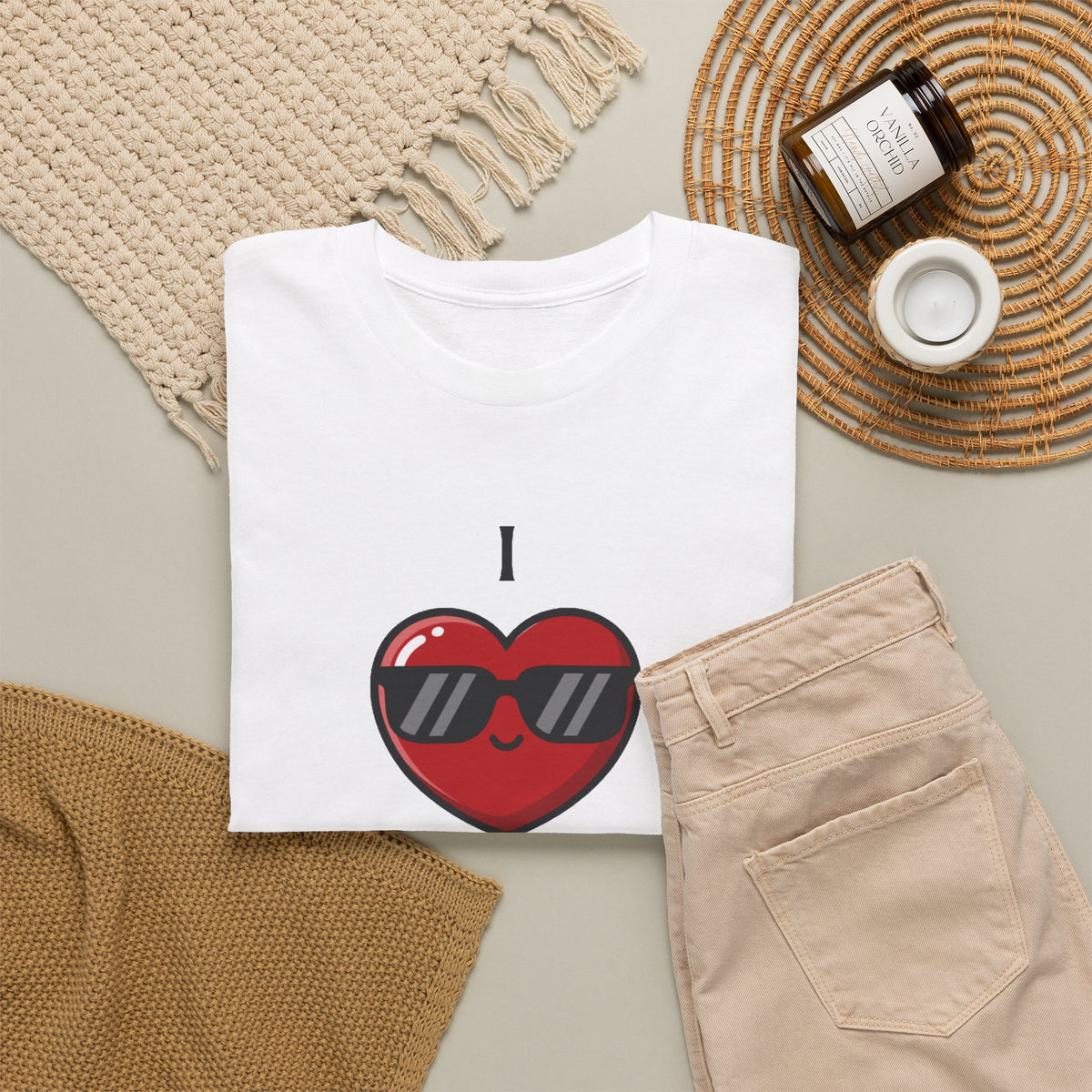 I Love Pi 3.14159 math lover graphic tee in white, folded flat lay styled with a woven placemat, candle, sweater, and khaki pants