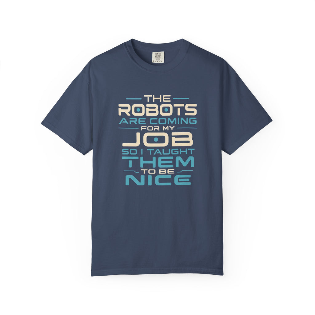 A navy blue short-sleeve t-shirt with a graphic text print on the front that reads 'THE ROBOTS ARE COMING FOR MY JOB SO I TAUGHT THEM TO BE NICE' in cream and light blue lettering, displayed on a clean white background.