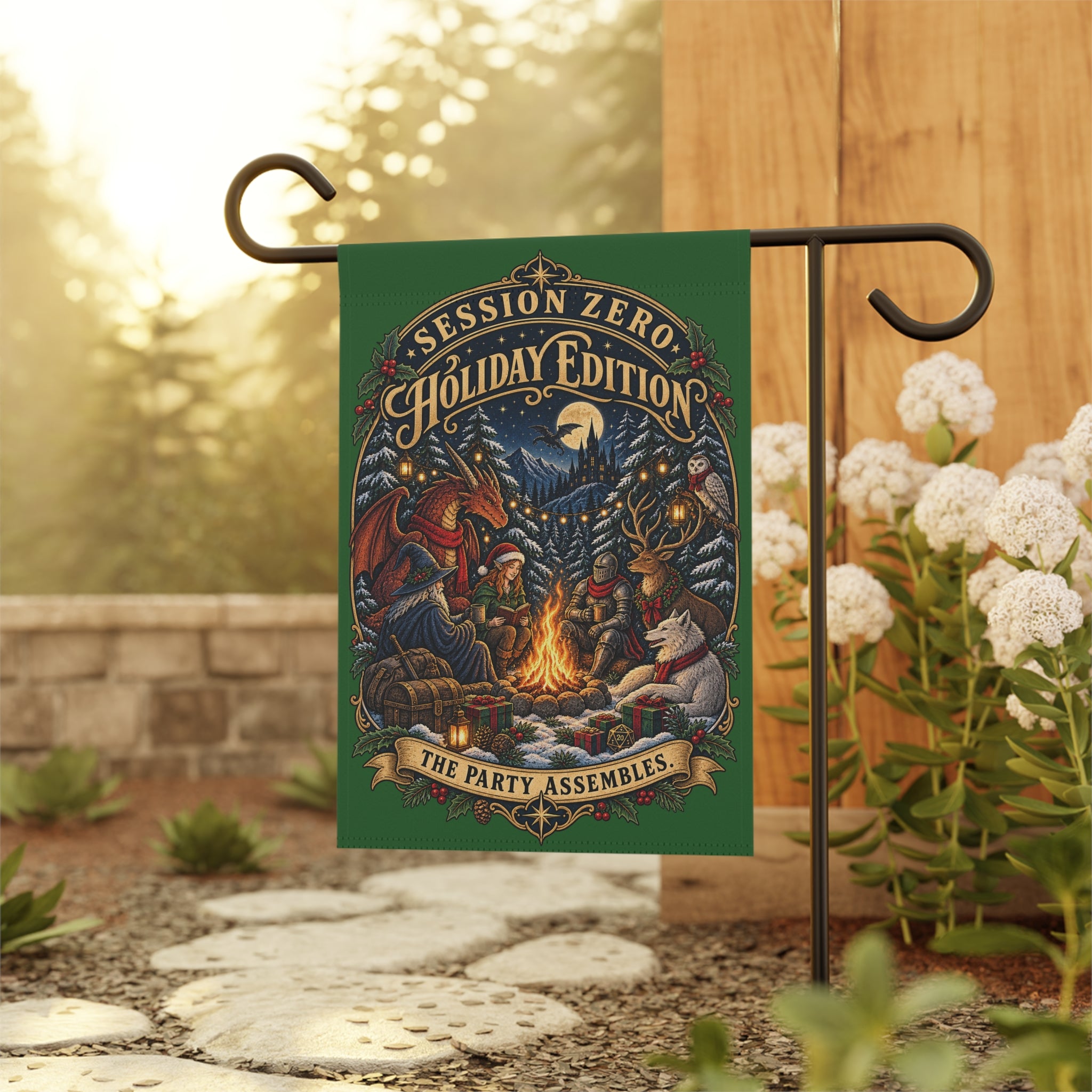 A decorative garden flag hanging from a black metal stand outdoors. The flag has a dark green border and a colorful illustrated scene around a campfire with the text 'Session Zero Holiday Edition' and 'The Party Assembles.