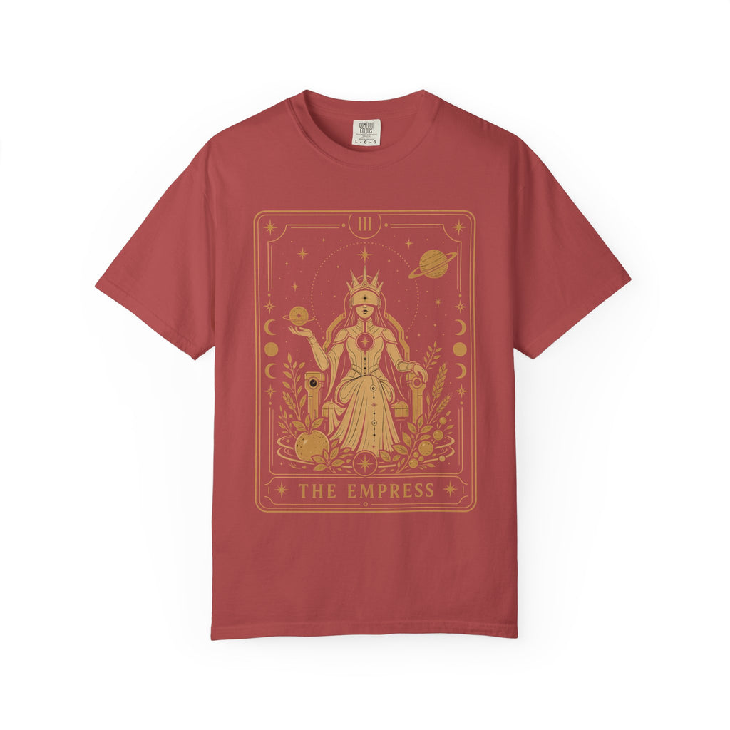 A short-sleeve crewneck t-shirt in a muted brick red color, featuring a large gold tarot card graphic of 'The Empress' on the front, displayed against a clean white background.