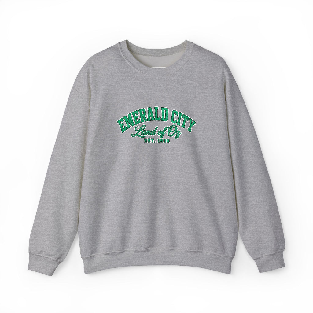 A gray crewneck sweatshirt with 'EMERALD CITY Land of Oz EST. 1893' printed in green on the chest, displayed against a plain white background.