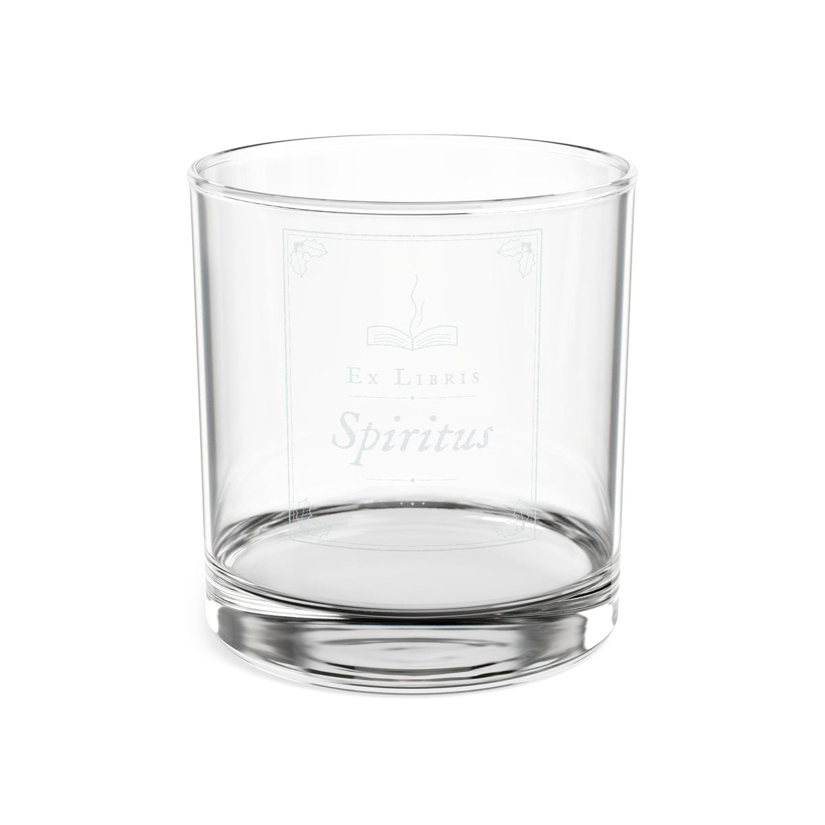 Clear glass tumbler with 'Ex Libre Spiritus' engraving on a white background
