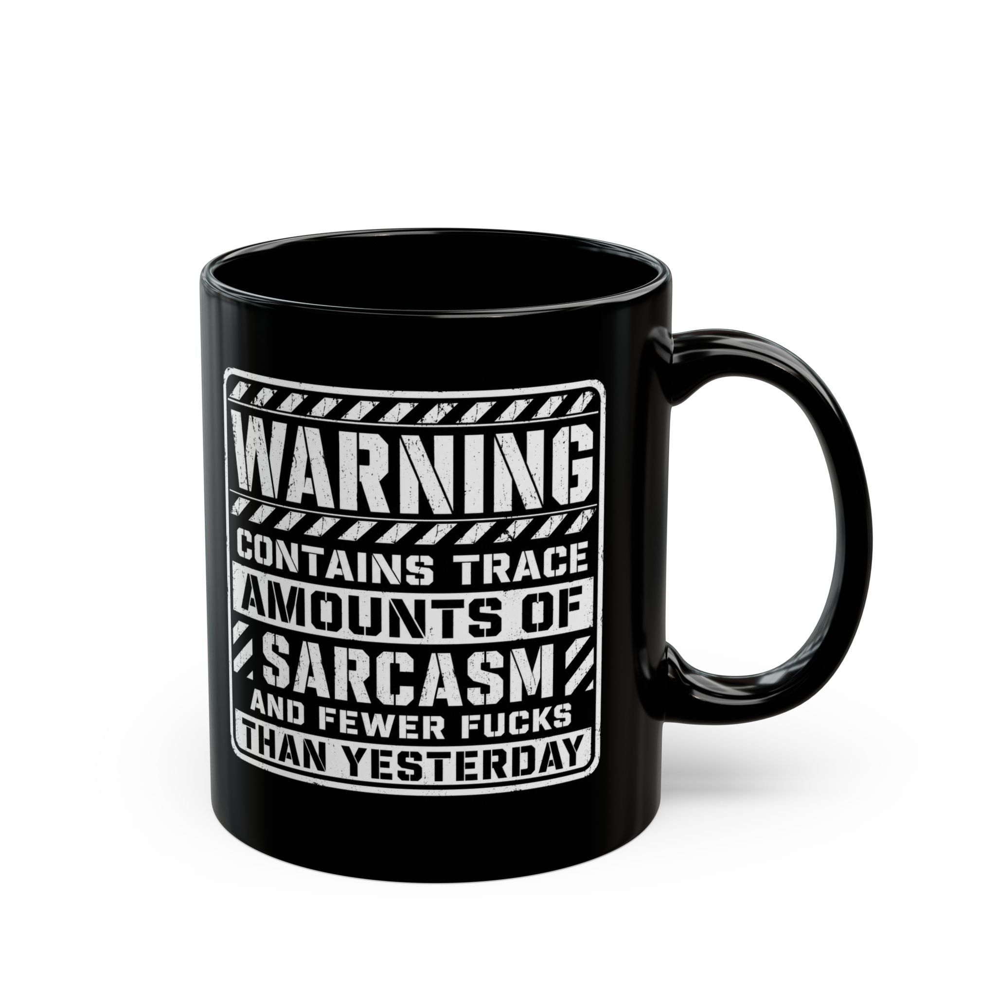 Black ceramic coffee mug printed with the warning label "Contains Trace Amounts of Sarcasm."