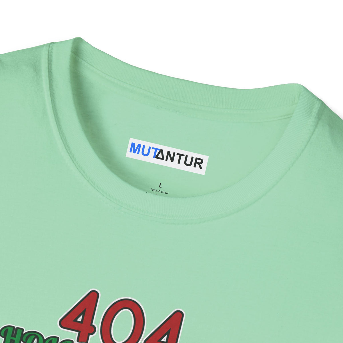Close-up of a mint green t-shirt showing the inner neck label with 'MUTANTUR' and the top of a graphic print with red and green text.