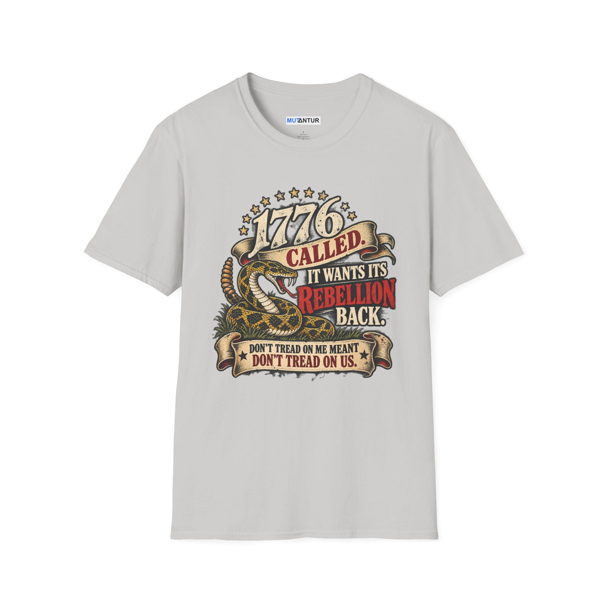 A light gray short-sleeve crewneck t-shirt featuring a detailed graphic print on the front. The graphic depicts a coiled rattlesnake with the text '1776 CALLED IT WANTS ITS REBELLION BACK DONT TREAD ON ME MEANS DONT TREAD ON US  against a white background
