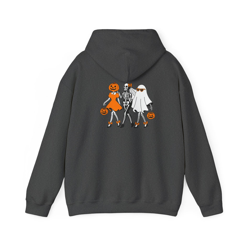 A dark gray hoodie shown from the back, featuring a graphic print of three Halloween characters: a pumpkin-headed girl in an orange dress, a skeleton in a white shirt, and a ghost in a white dress, all holding orange pumpkins.