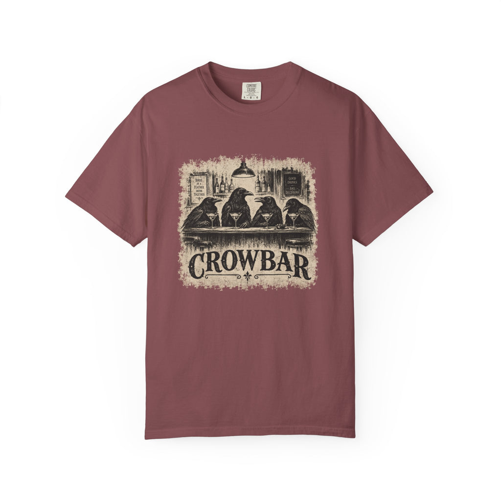 A short-sleeve crewneck t-shirt in a dark red color, featuring a distressed vintage-style graphic print of four crows sitting at a bar with the text 'CROWBAR' underneath, displayed on a clean white background.