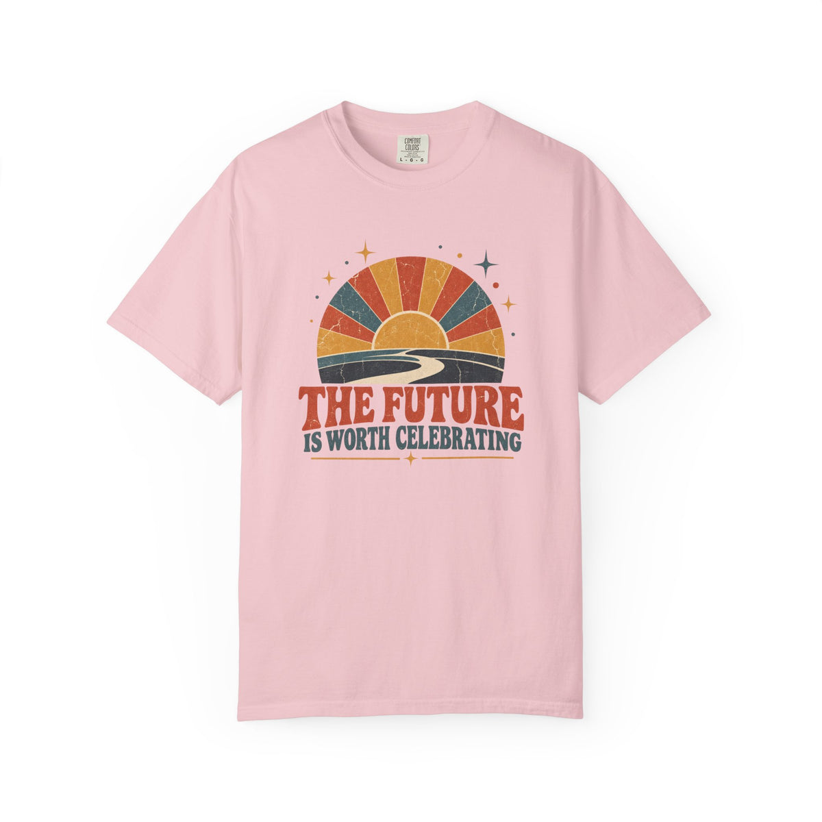 A light pink short-sleeve crewneck t-shirt featuring a retro sunset graphic with the text 'THE FUTURE IS WORTH CELEBRATING' printed on the chest.